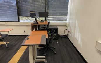 professor's desk at the front of classroom