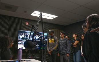 student standing in recording studio