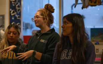three student females standing