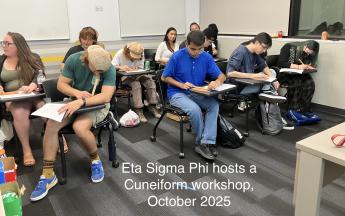 students sitting at desks working on clay