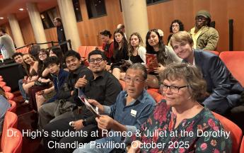 people sitting in an opera house