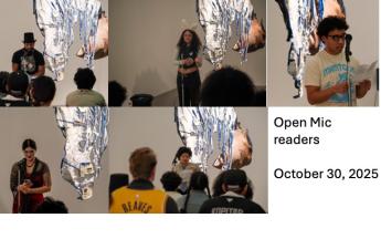 people standing by a sculpture reading 