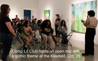 people sitting around art piecees in a museum