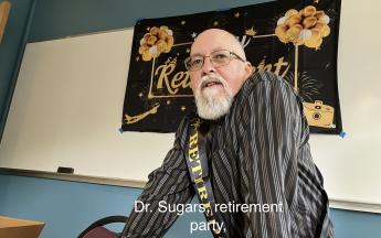 man wearing sash saying retired