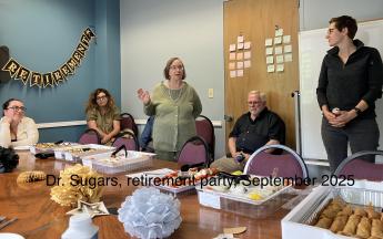 five people around a table
