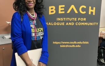 woman standing beside step and repeat
