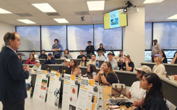 a MAle Marketing Professor presenting at day at the beach