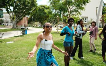 Prof. Tashara Gavin Moorhead and group of students dancing