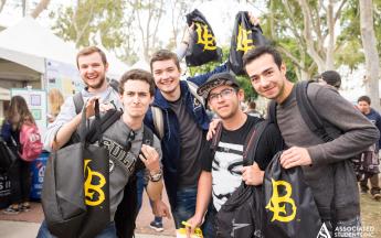 2018 TechDay Students showing TechDay merchandise