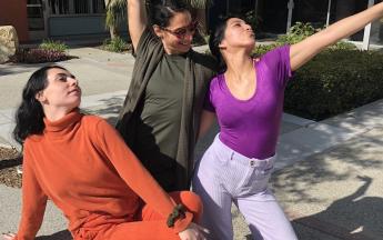 Students pose with teacher during Spirit Week