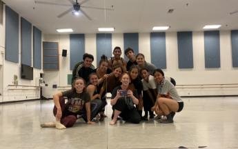 Dancers pose for group photo in studio