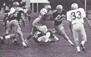 A Cal Poly player attempts a face mask tackle.Cal Poly garnered a penalty for the effort 