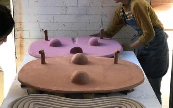 Artist in residence Anna Sew Hoy loading a kiln, 2018.