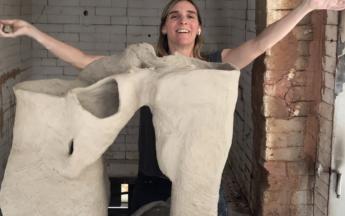 Artist in residence Jessica Jackson Hutchins building a large sculpture on a kiln car, 2019.