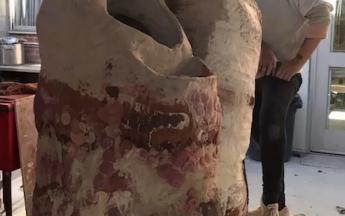 Artist in residence Jennie Jieun Lee building a large sculpture on a kiln car, 2018.