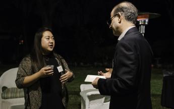 Public Affairs student assistant Angela Yim and Communication Studies Professor José Rodríguez catch up during the Public Knowledge Media Training culmination celebration.