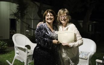 Anthropology’s Mitra Baghdadi accepts her Public Knowledge Media Training certificate of completion from President Jane Close Conoley.