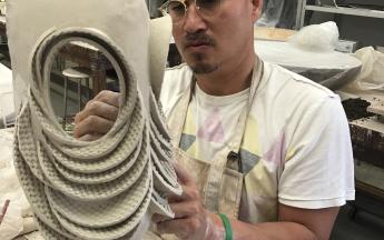 Artist in residence Tam Van Tran working in the Ceramic Arts studio, 2019.