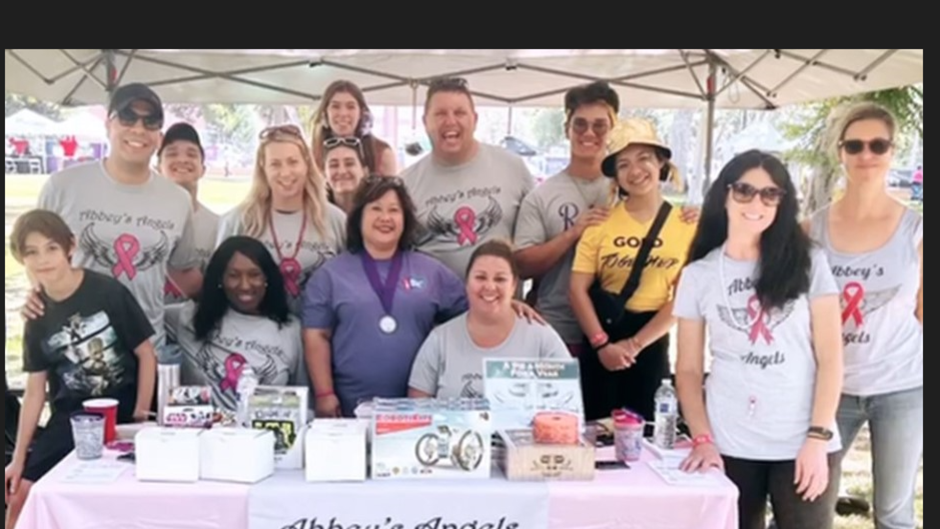 Abbeys Angels Cancer Team at table for Relay for Life