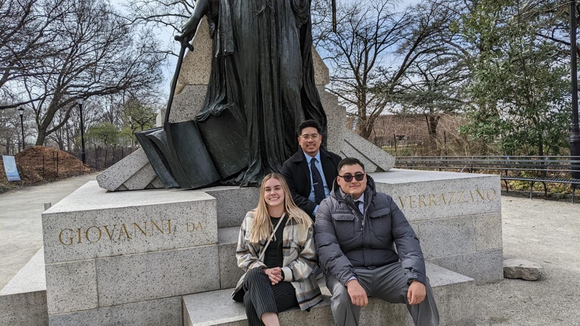 Picture text: “BIG Kids in front of the Giovanni da Verrazzano Statue in Battery Park, New York”