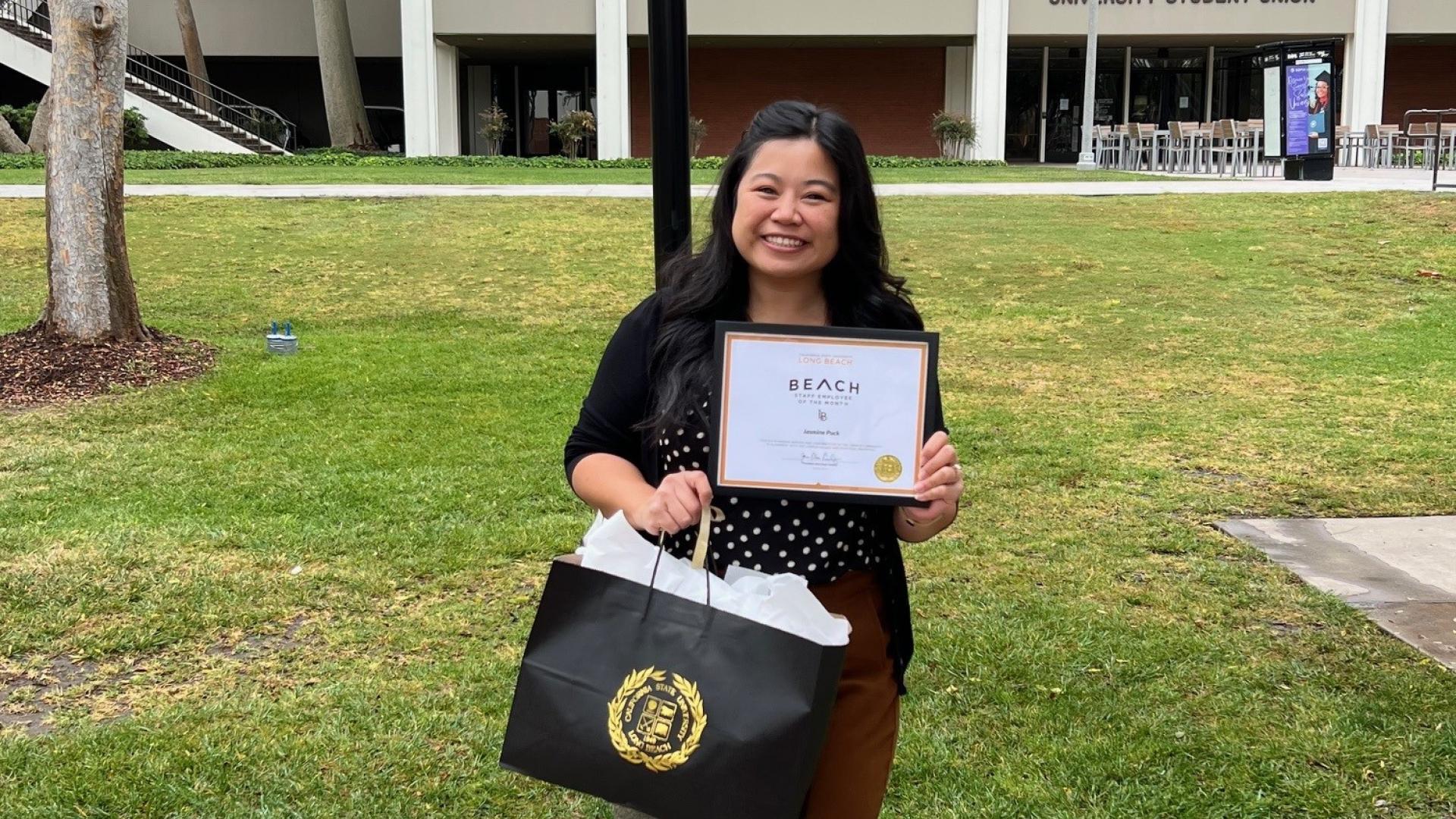Jasmine Puck and her name sign on campus