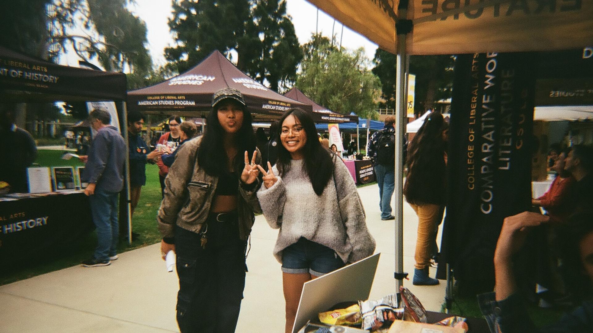 students standing in front of CWL booth
