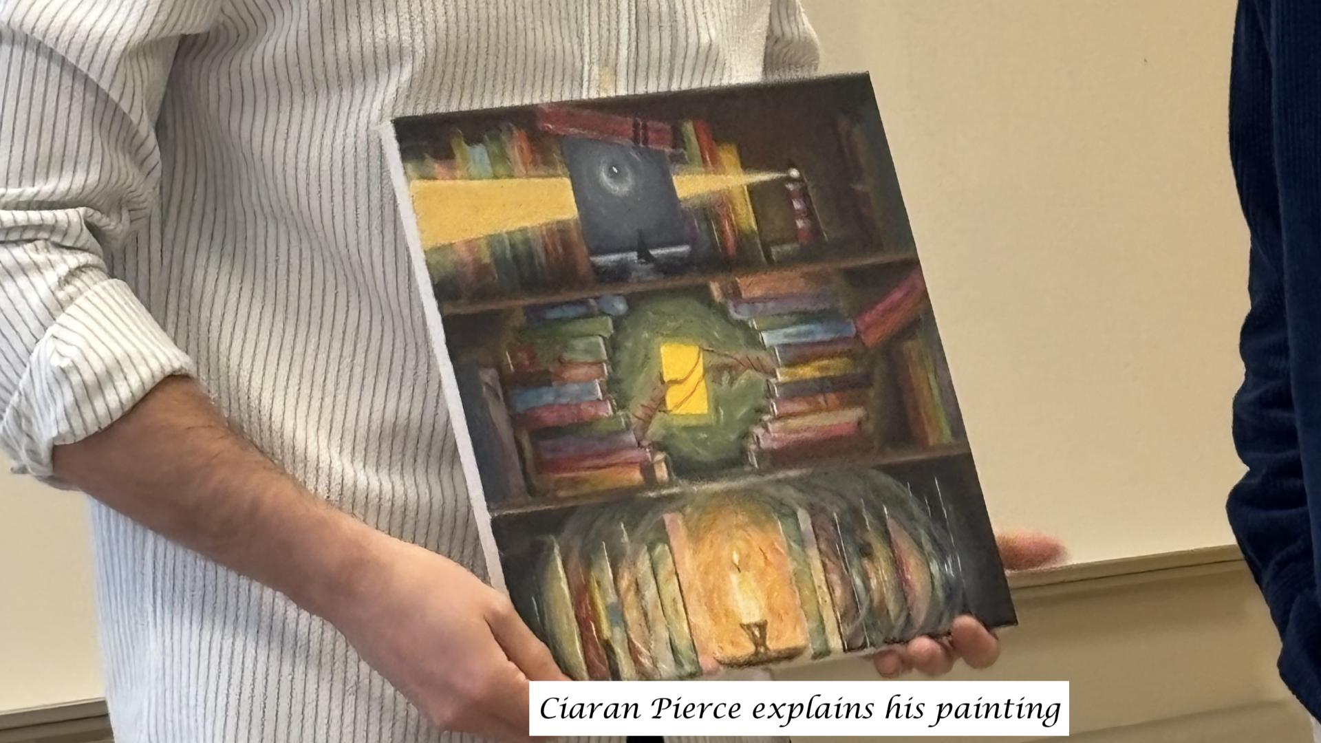 a person holding a painting of a bookshelf