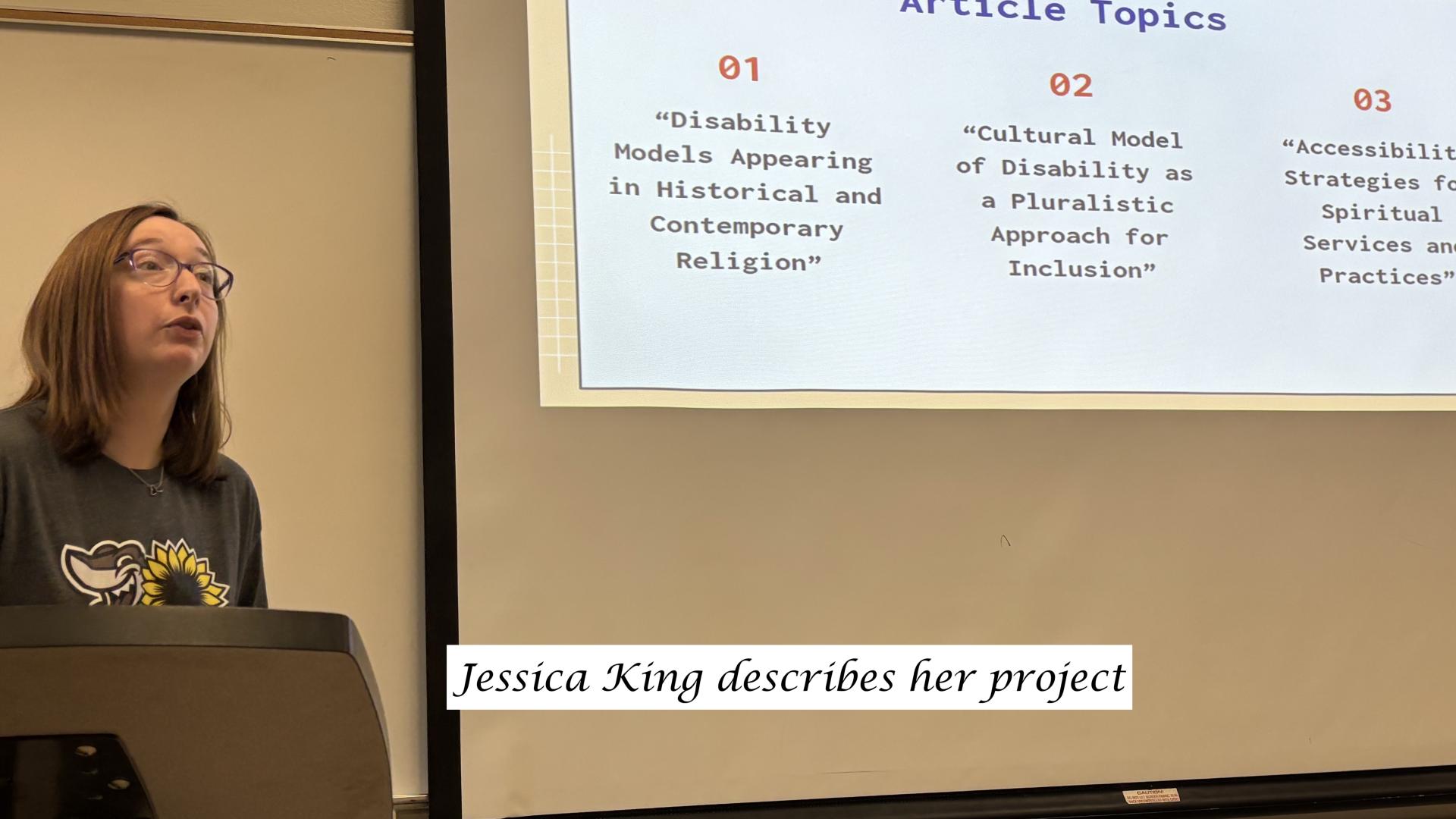 a student talking in front of a slideshow