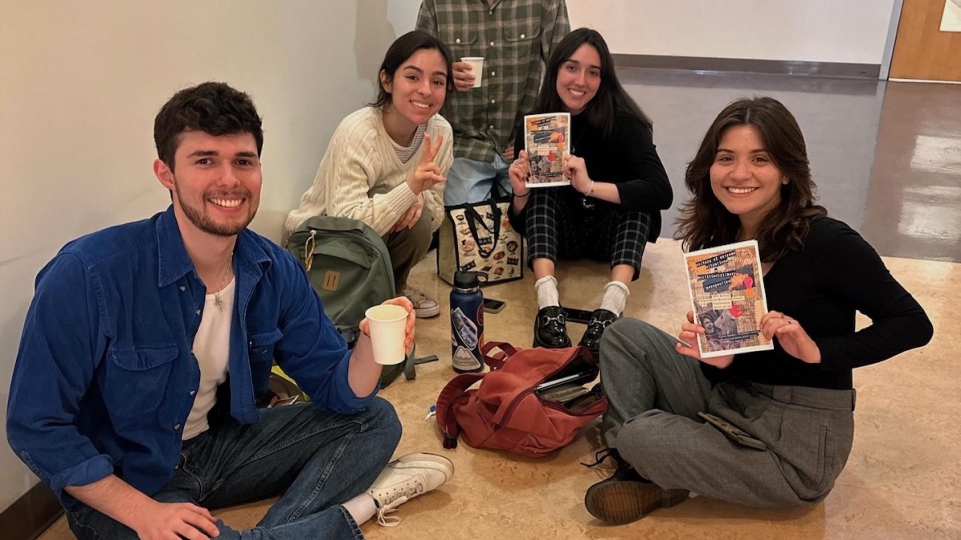 students sitting on floor
