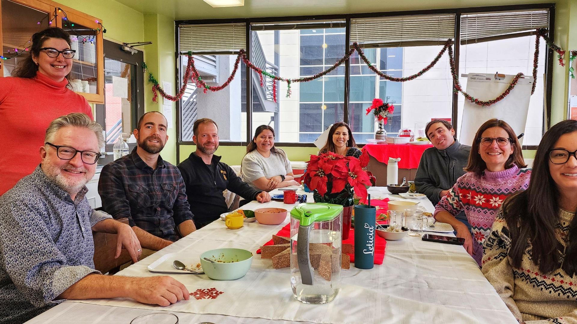 Sustainability Champions celebrating the holidays with a potluck.
