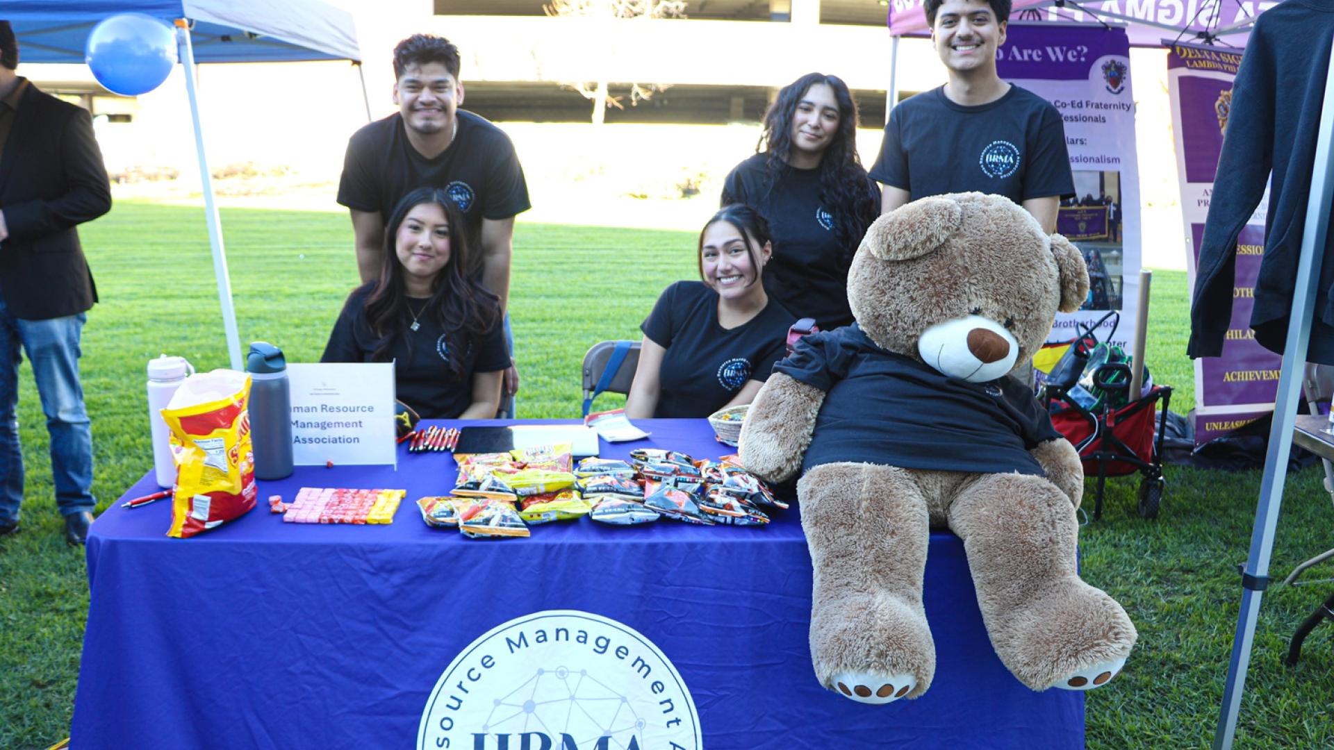 COB CSS get down to business 2026 Spring table of students with bear