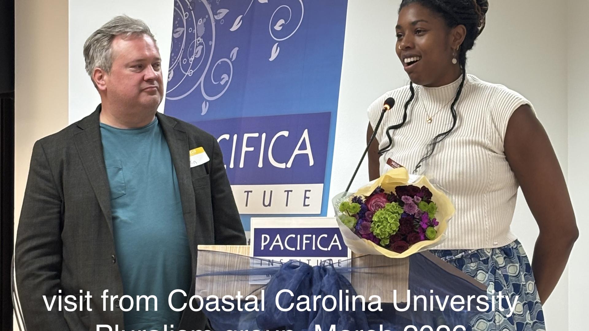 two people speaking behind a podium