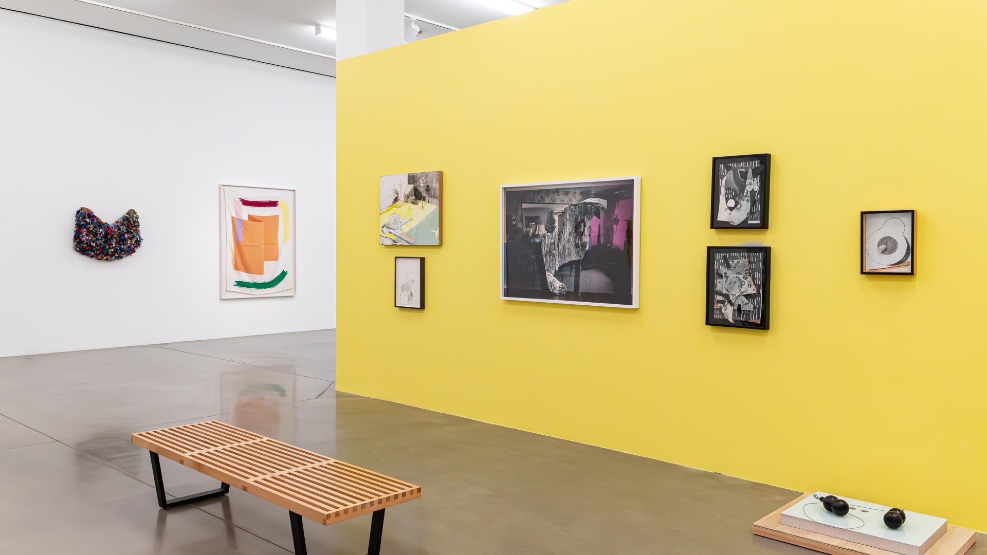 Multiple art pieces shown in the university art museum