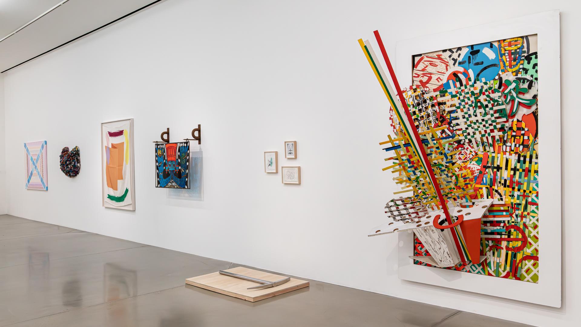 Multiple art pieces shown in the university art museum