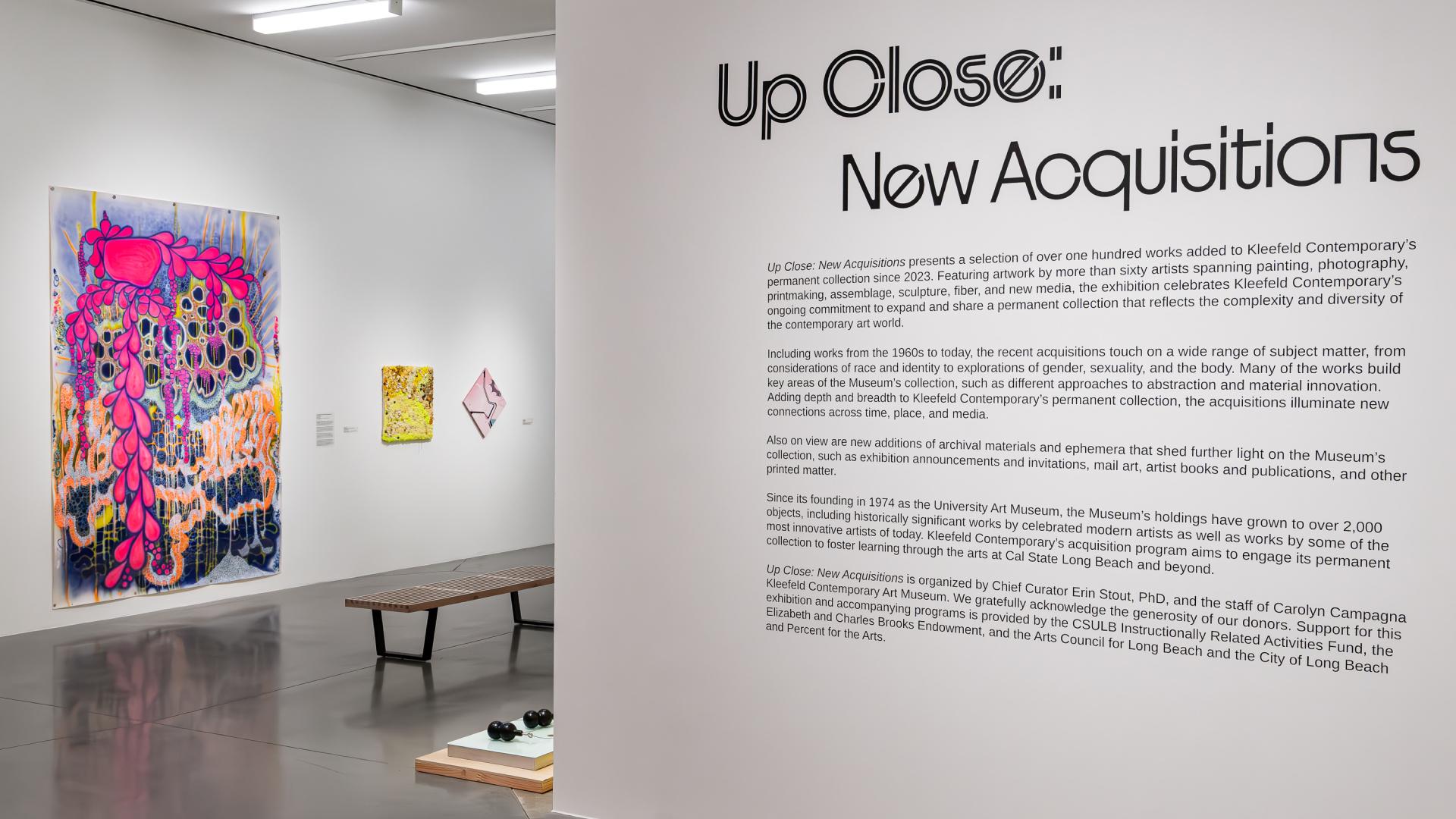 Multiple art pieces shown in the university art museum