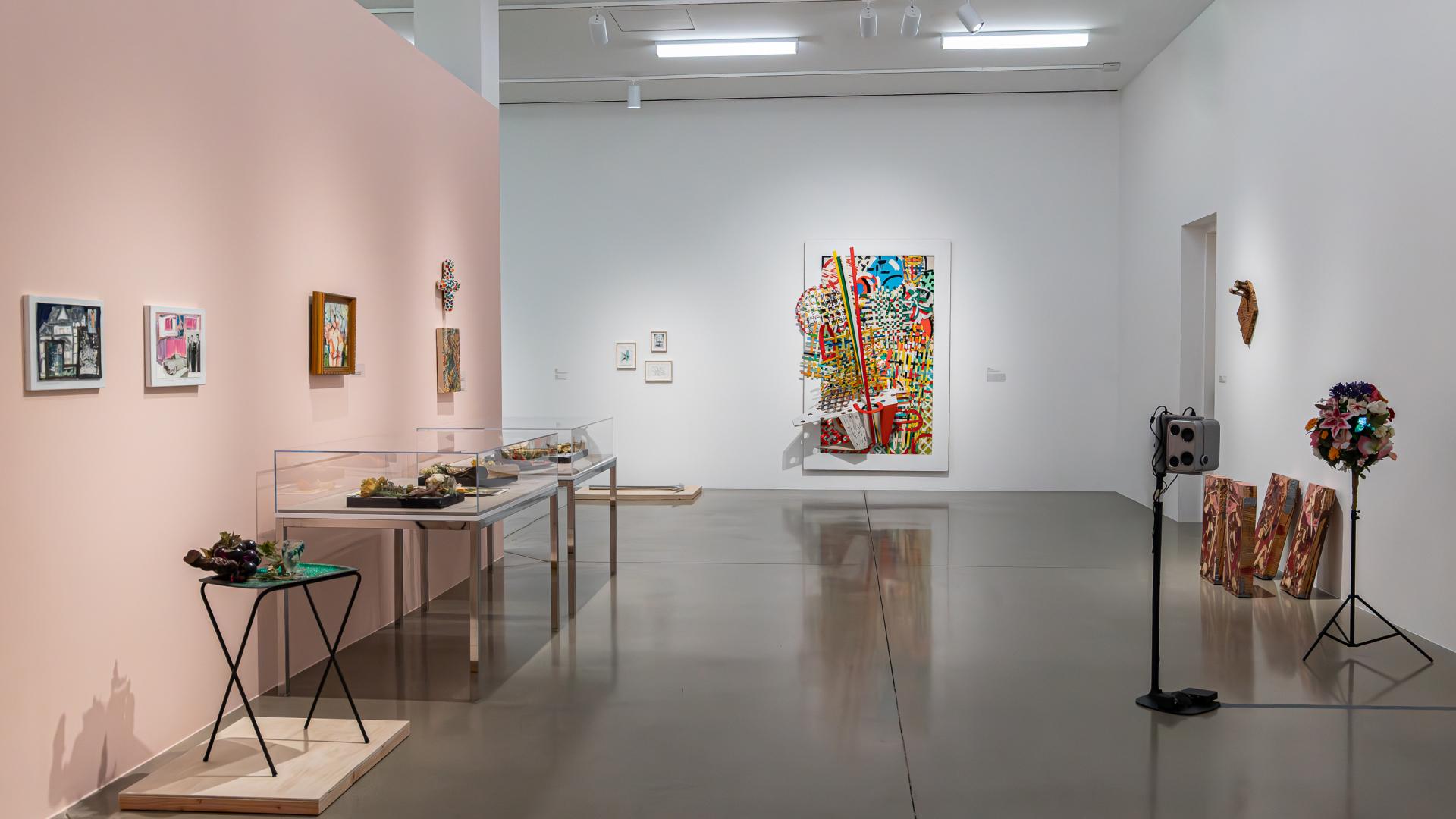 Multiple art pieces shown in the university art museum