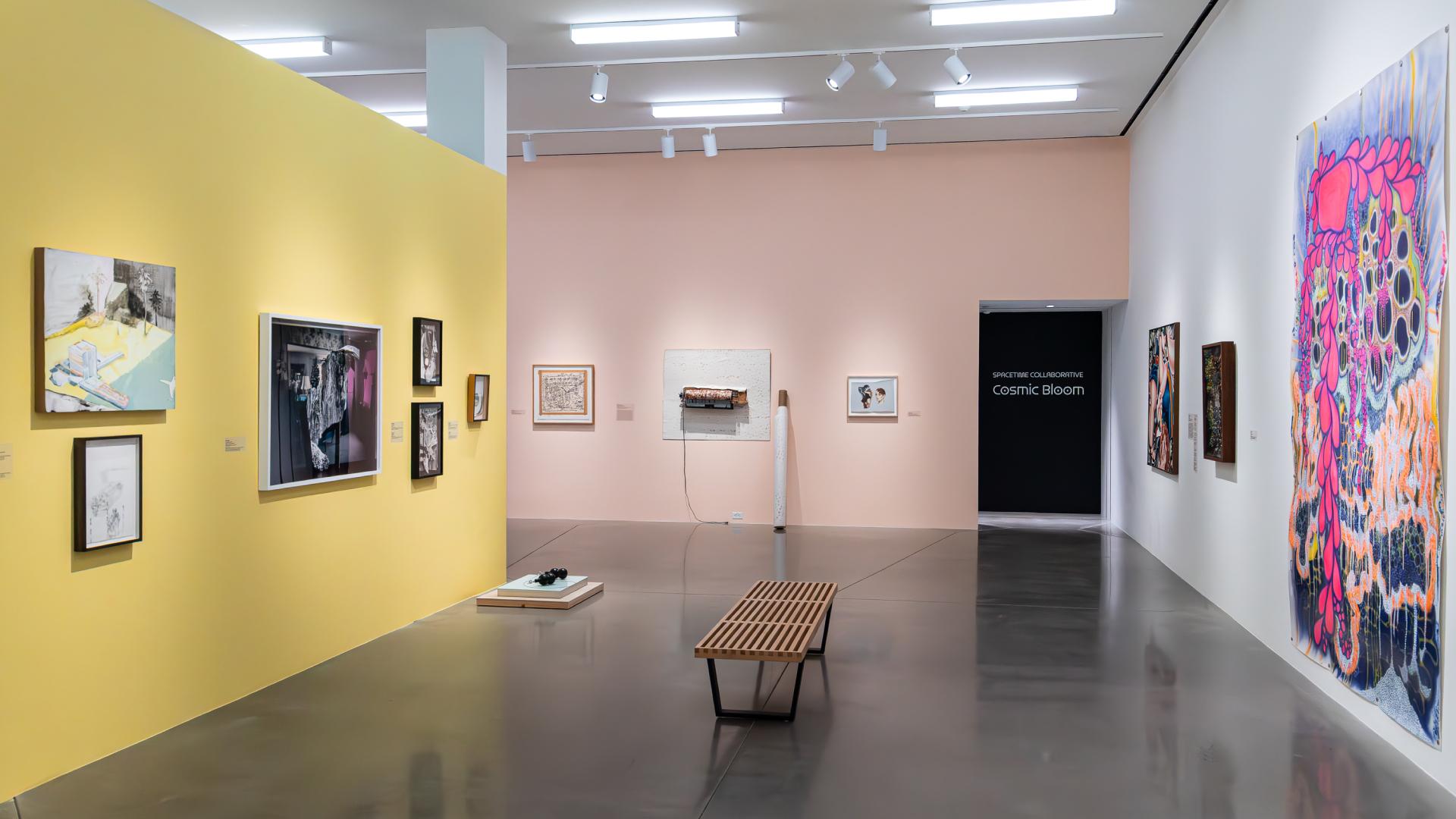 Multiple art pieces shown in the university art museum