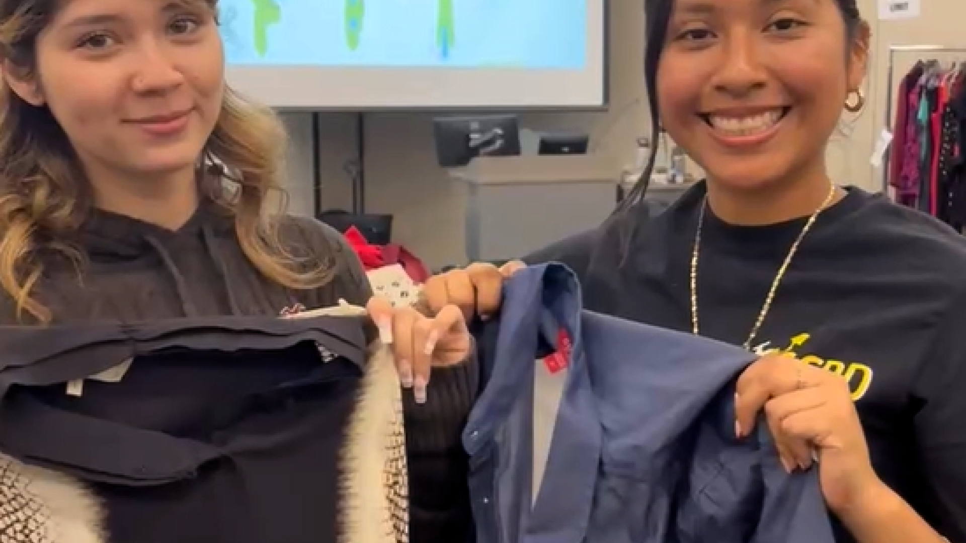 Two students showing what they are selecting clothes