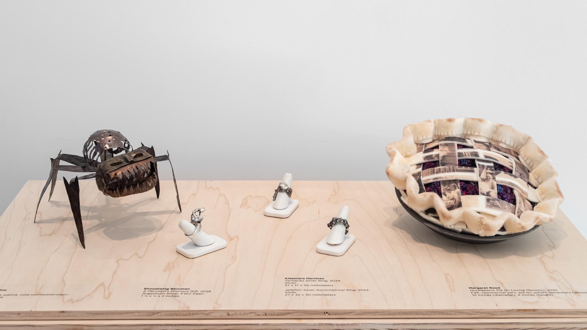 Five pieces of artwork on display in the university art museum