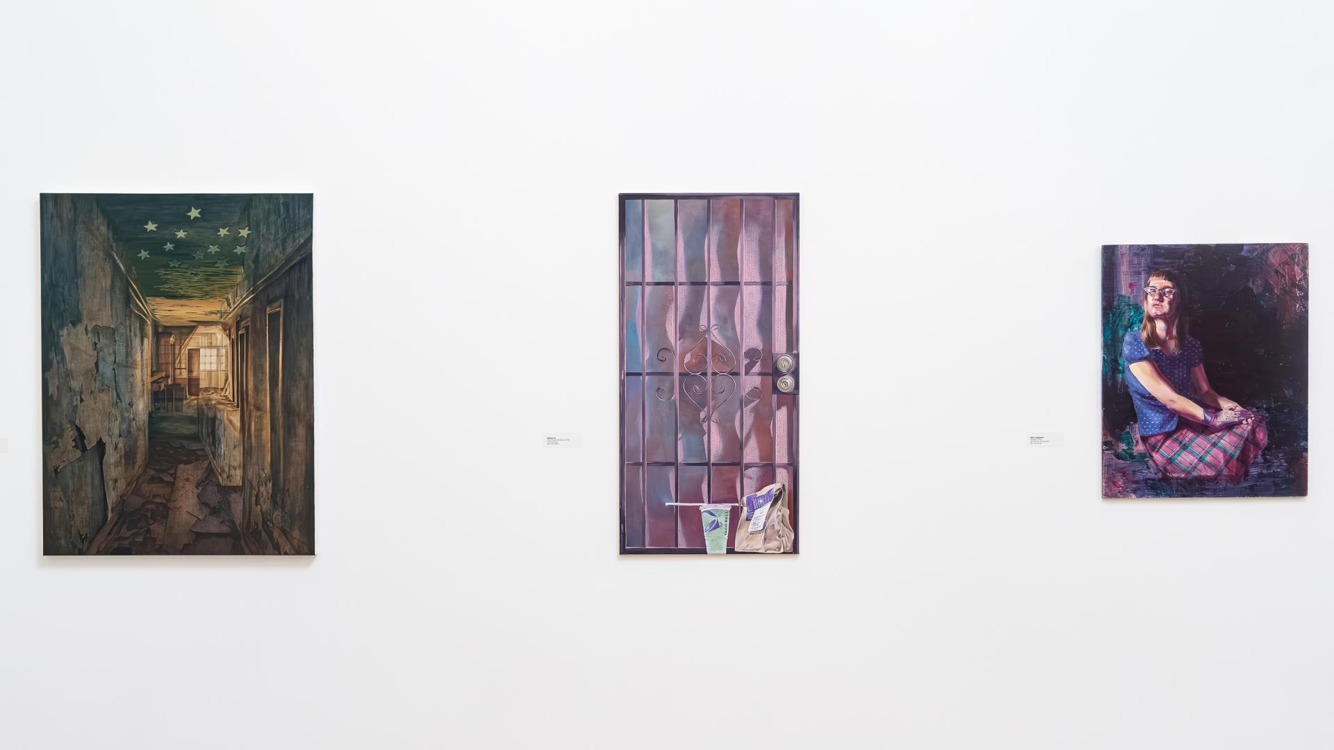 Three pieces of artwork on display in the university art museum