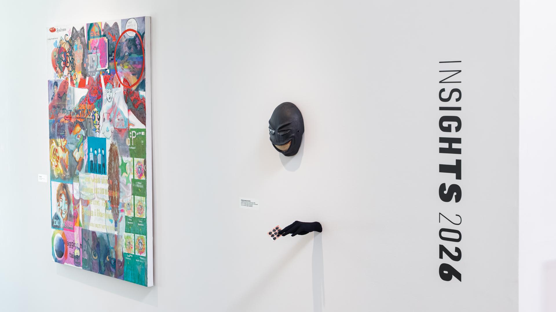 Two pieces of artwork on display in the university art museum