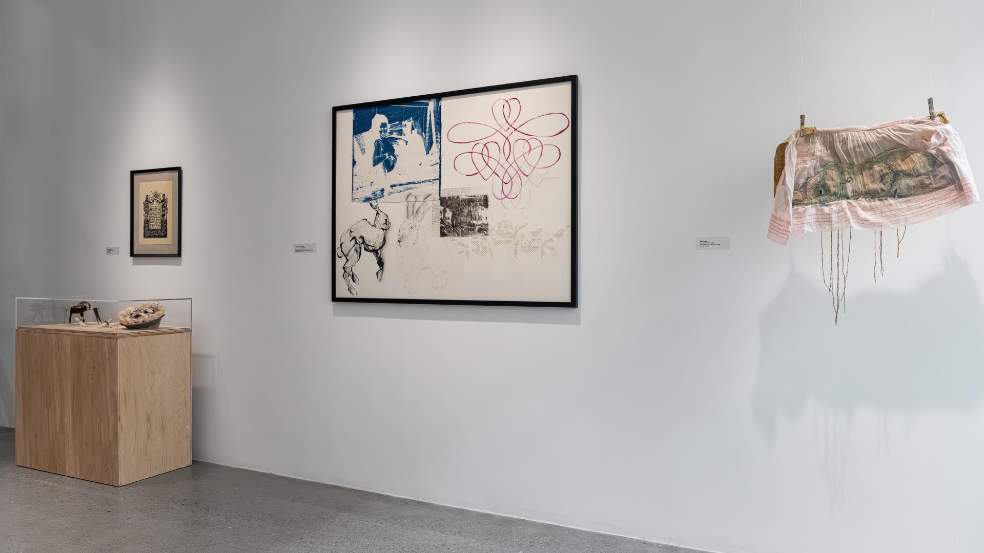 Three pieces of artwork on display in the university art museum