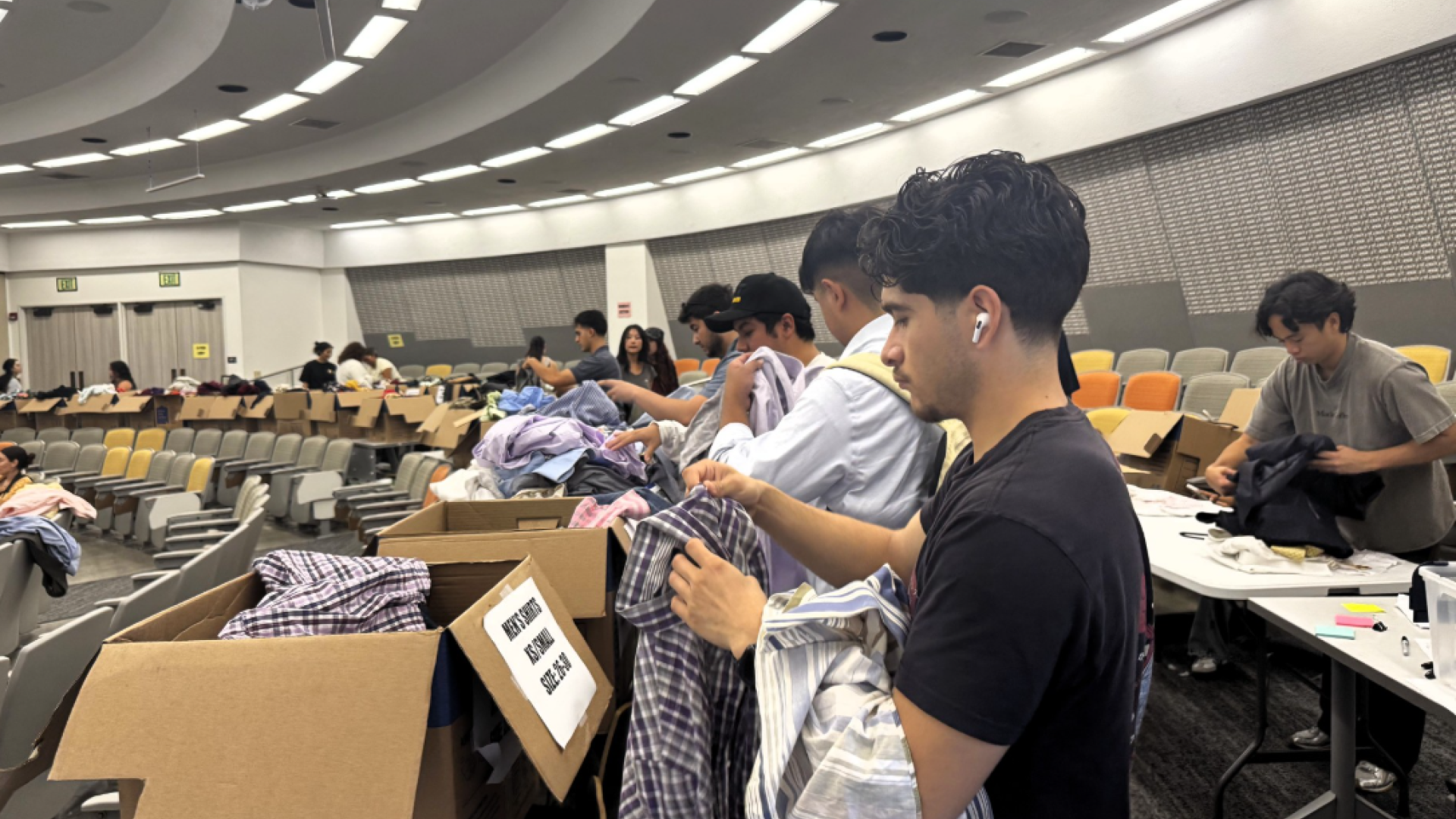 SCPD Closet Male students picking clothes 2026 COB