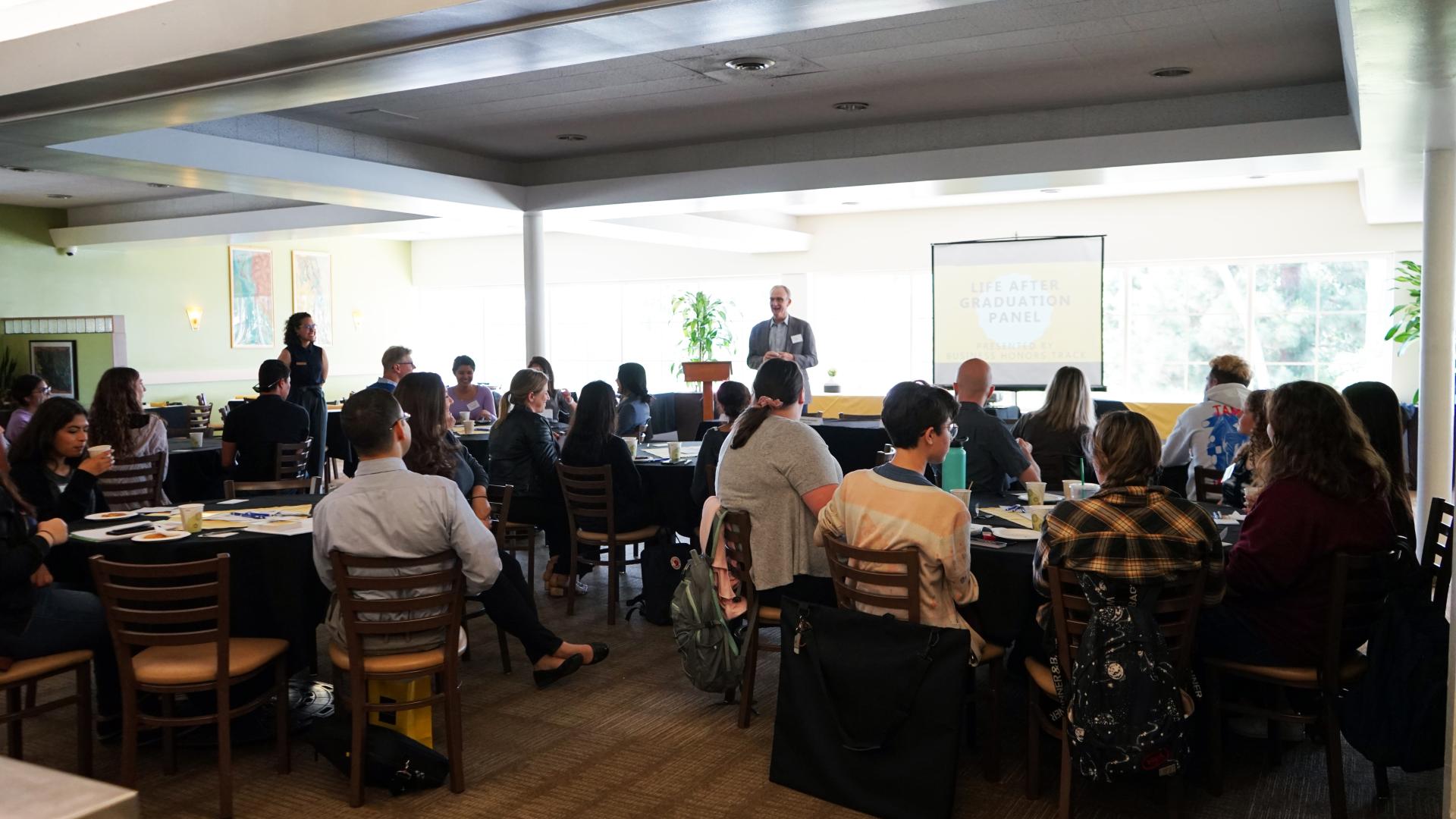 Dean Solt speaker at Honors program life after graduation event COB 2019 HONORS LIFE AFTER GRADUATION Event Panel speakers in a room