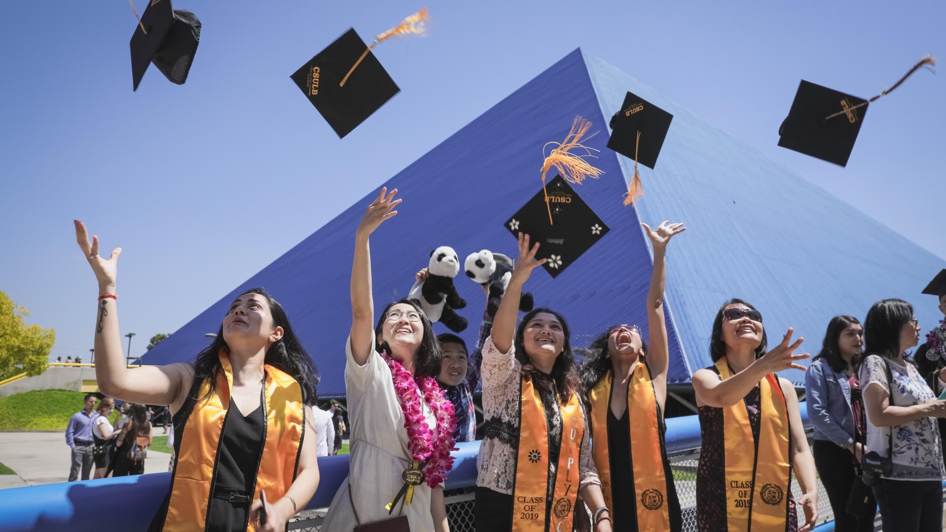 Students Throwing Grad Caps