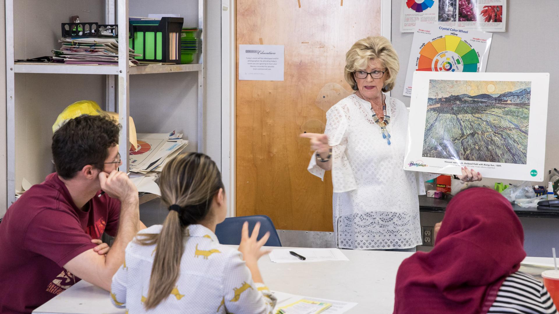 teacher shows painting