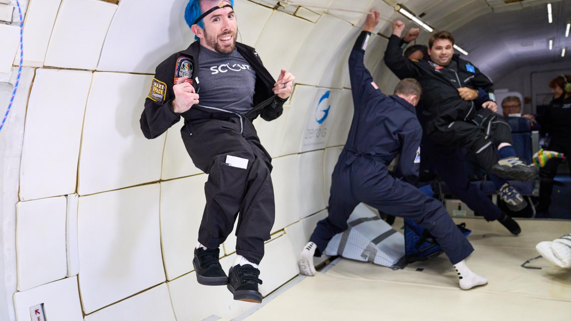 Space crew member gives thumbs up to flight