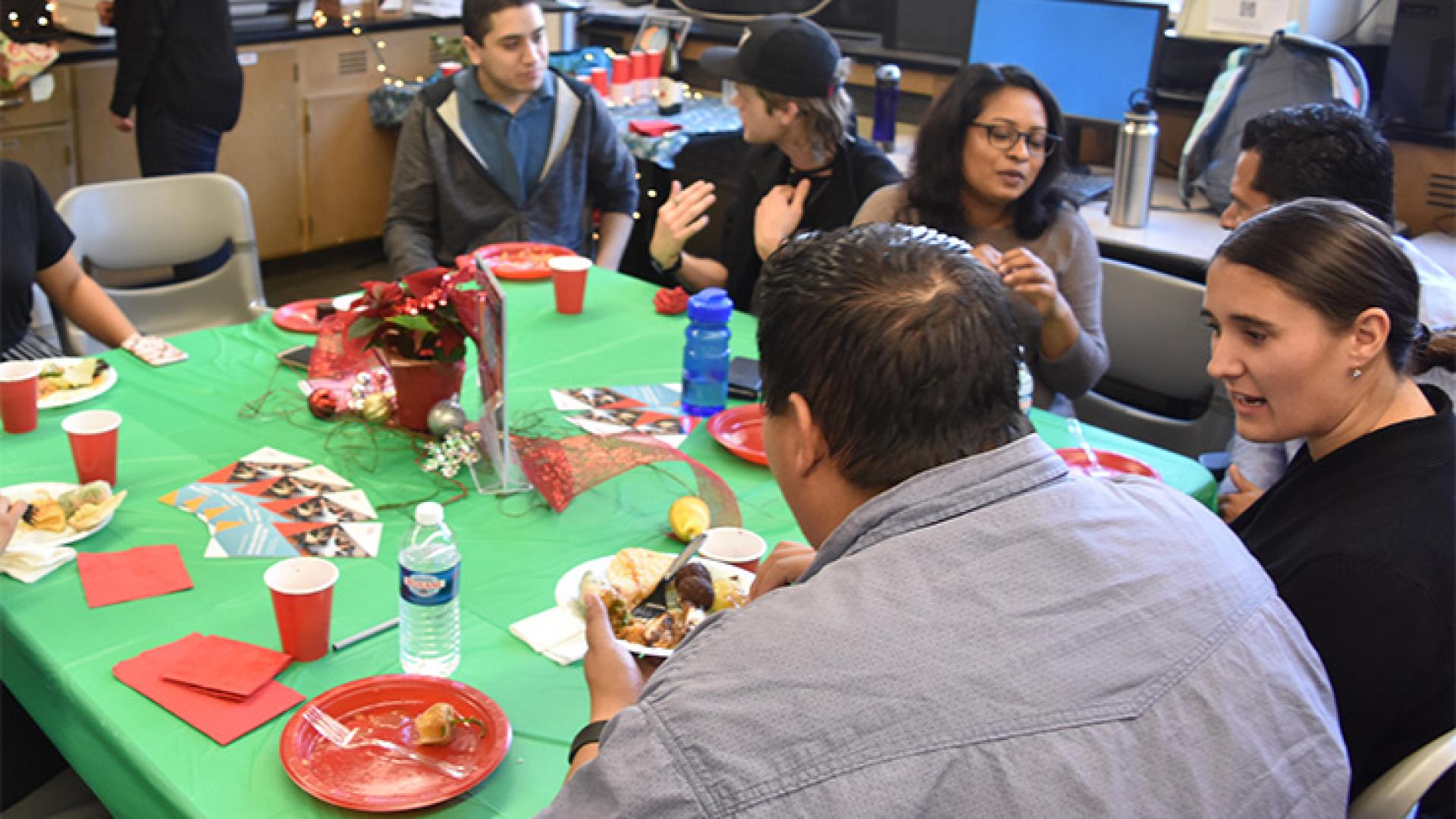 Faculty and staff enjoy the December 2017 CSULB BUILD Holiday Faculty Mixer