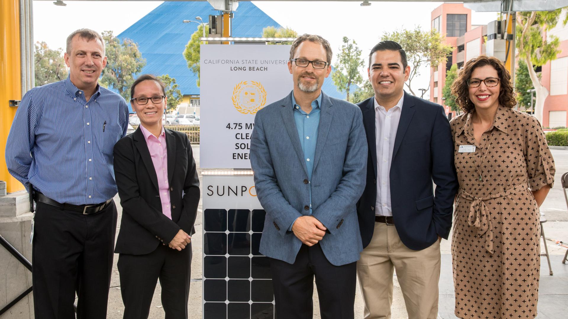 officials at solar panel unveiling