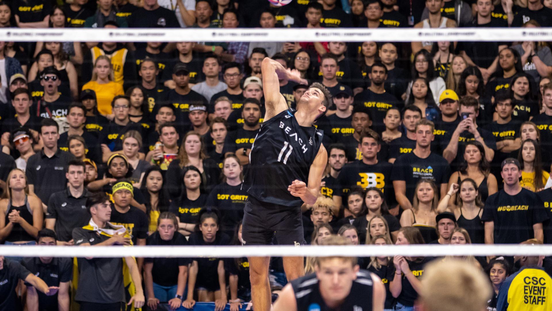 TJ Defalco spikes volleyball